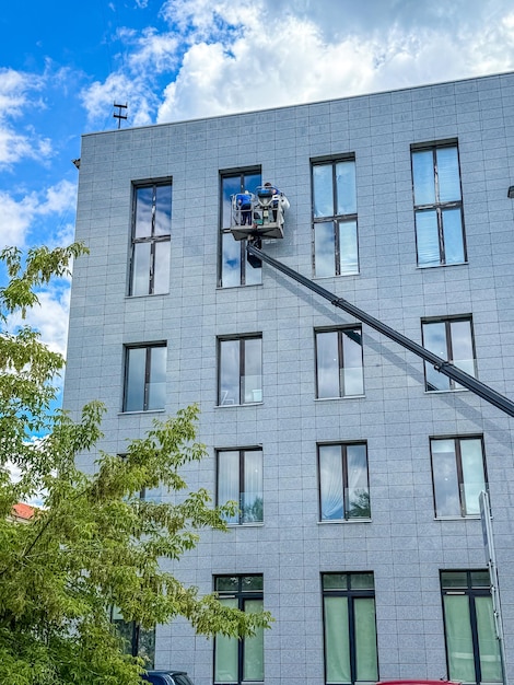 worker-cleaning-windows-service-building-high-quality-photo_1239079-368